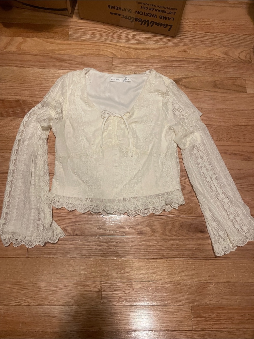 Altar'd State Cream Lace Peasant Blouse with Tie Front. feminine detail